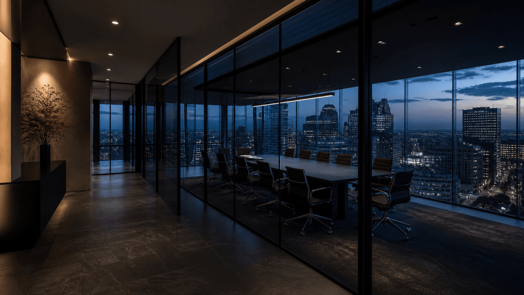A dark, glass-walled executive office overlooking a city at blue hour